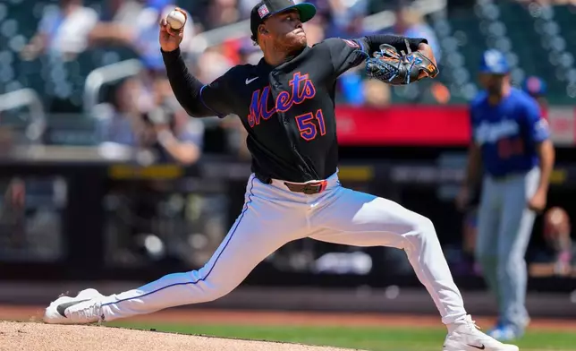 New York Mets pitcher Freddy Peralta (51) throws during the first inning of a baseball game against the Los Angeles Dodgers, Sunday, July 26, 2026, in New York. (AP Photo/Yuki Iwamura)