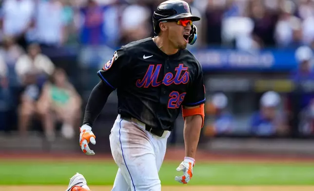 New York Mets' Tyrone Taylor reacts after hitting a three-run home run during the sixth inning of a baseball game against the Los Angeles Dodgers, Sunday, July 26, 2026, in New York. (AP Photo/Yuki Iwamura)