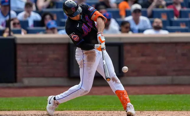 New York Mets' Tyrone Taylor hits a three-run home run during the sixth inning of a baseball game against the Los Angeles Dodgers, Sunday, July 26, 2026, in New York. (AP Photo/Yuki Iwamura)
