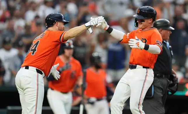 Detroit Tigers' Kevin McGonigle, right, celebrates his two-run home rune with Jake Rogers (34) against the Philadelphia Phillies during the third inning Friday, July 10, 2026, in Detroit. (AP Photo/Paul Sancya)