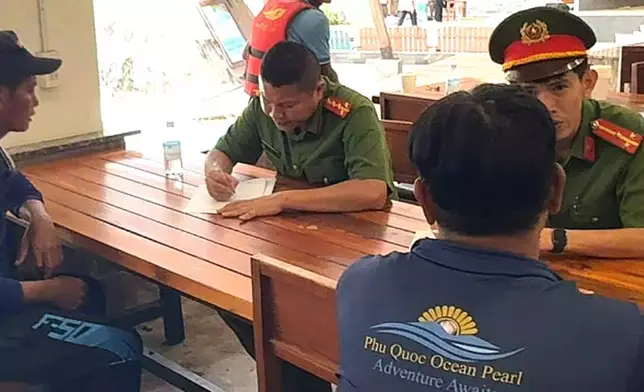 Investigators with crew members involved in the speedboat incident in Phu Quoc, Vietnam, Sunday, July 12, 2026. (VNA/Tran Van Si)