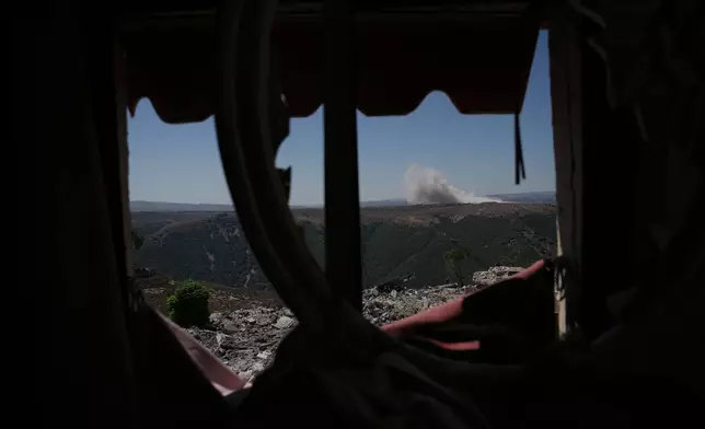 Smoke rises following an explosion in an Israeli-occupied area, as seen from Zawtar al-Gharbieh, southern Lebanon, Tuesday, July 28, 2026. (AP Photo/Hassan Ammar)
