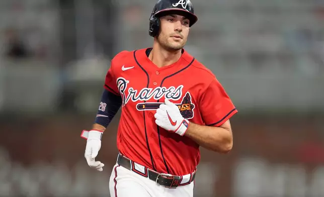 Atlanta Braves' Matt Olson (28) celebrates hitting a solo homerun in the fourth inning of a baseball game against the Texas Rangers, Friday, July 17, 2026, in Atlanta. (AP Photo/Mike Stewart)