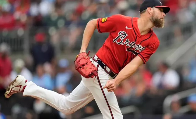 Atlanta Braves pitcher Chris Sale (51) works in the first inning of a baseball game against the Texas Rangers, Friday, July 17, 2026, in Atlanta. (AP Photo/Mike Stewart)