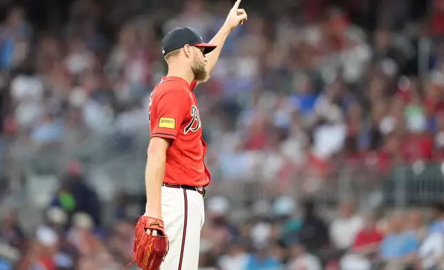 Atlanta Braves pitcher Chris Sale (51) waves to the crowd after pitching 2,700 lifetime stikeouts in the fifth inning of a baseball game against the Texas Rangers, Friday, July 17, 2026, in Atlanta. (AP Photo/Mike Stewart)