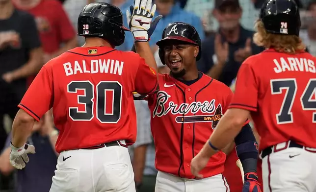 Atlanta Braves' Drake Baldwin (30) celebrates his three-run homer against the Texas Rangers in the fourth inning of a baseball game, Friday, July 17, 2026, in Atlanta. (AP Photo/Mike Stewart)