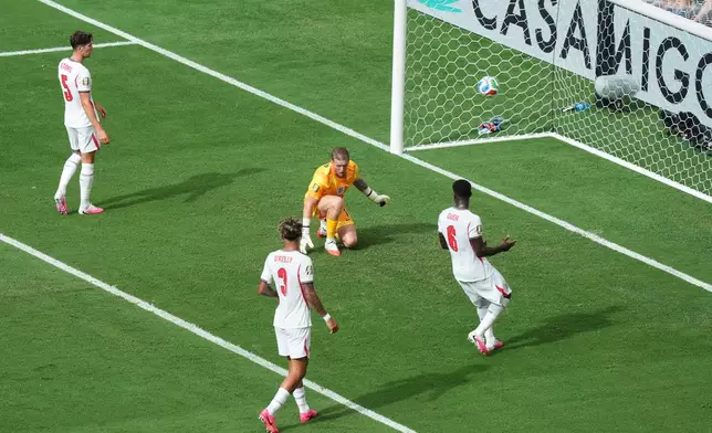 England goalkeeper Jordan Pickford (1), John Stones (5), Nico O'Reilly (3) and Marc Guehi (6) react after Norway's Andreas Schjelderup, not pictured, scored their side's first goal during the World Cup quarterfinal soccer match between Norway and England in Miami Gardens, Fla., Saturday, July 11, 2026. (AP Photo/Marta Lavandier)