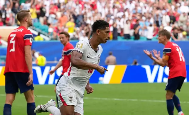 England's Jude Bellingham celebrates after scoring his side's first goal during the World Cup quarterfinal soccer match between Norway and England in Miami Gardens, Fla., Saturday, July 11, 2026. (AP Photo/Rebecca Blackwell)