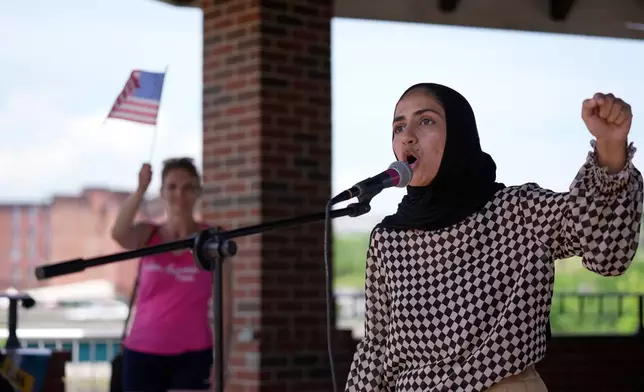Eisha Khan speaks at a rally of protesters near the scene of a shooting involving U.S. Immigration and Customs Enforcement, Monday, July 13, 2026 in Biddeford, Maine. (AP Photo/Robert F. Bukaty)