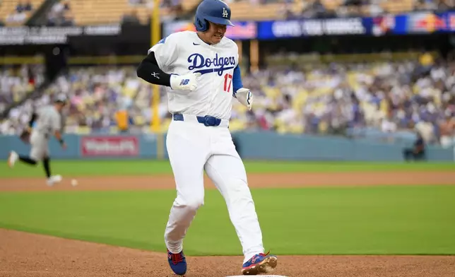Los Angeles Dodgers' Shohei Ohtani runs to third base during the third inning of a baseball game against the Arizona Diamondbacks in Los Angeles, Sunday, July 12, 2026. (AP Photo/Kyusung Gong)