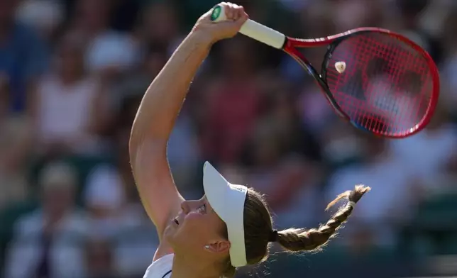 Elena Rybakina of Kazakhstan eyes the ball as she prepares to return it to Lois Boisson of France in their first round women's singles match at the Wimbledon Tennis Championships in London, Tuesday, June 30, 2026. (AP Photo/Kirsty Wigglesworth)