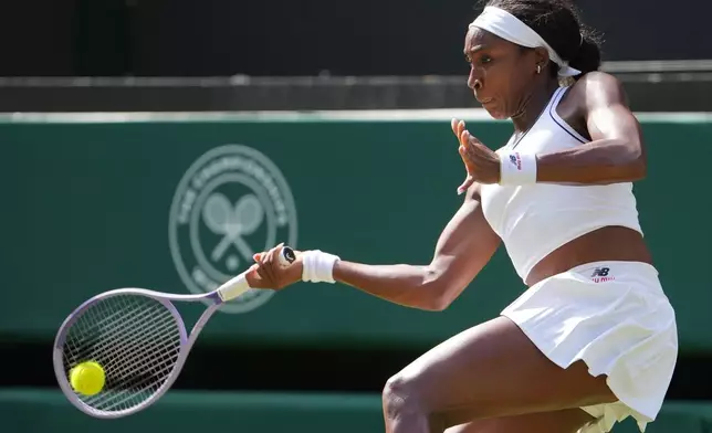 Coco Gauff of the United States plays a forehand against Solana Sierra of Argentina in their second round women's singles match at the Wimbledon Tennis Championships in London, Wednesday, July 1, 2026. (AP Photo/Kin Cheung)