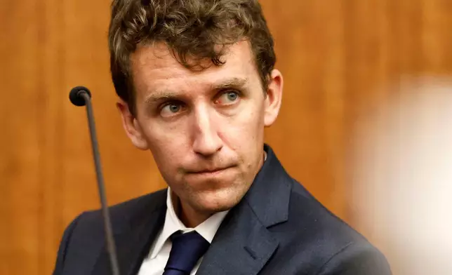 Patrick Clancy glances over at the defense table and his ex wife Lindsay Clancy is seated during her murder trial at the Plymouth Superior Court in Plymouth, Mass., Monday, July 27, 2026. (Greg Derr/The Patriot Ledger via AP, Pool)