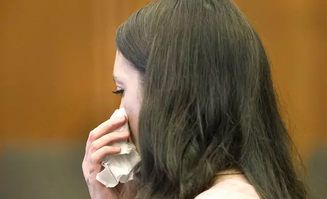 Defendant Lindsay Clancy fights back tears as the details of her children's death are read in court at Plymouth Superior Court in Plymouth, Mass., Monday, July 27, 2026. (Greg Derr/The Patriot Ledger via AP, Pool)