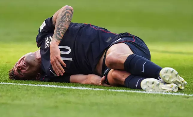 United States' Christian Pulisic reacts after a challenge during the World Cup round of 16 soccer match against Belgium in Seattle, Monday, July 6, 2026. (AP Photo/Manu Fernandez)
