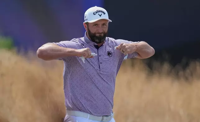 Jon Rahm of Spain gestures as he walks off the 1st tee during the final day of the British Open Golf championships at Royal Birkdale golf club, in Southport, England, Sunday, July 19, 2026. (AP Photo/Jon Super)