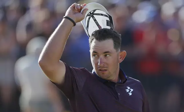 Lucas Herbert of Australia acknowledges the crowd on the 18th green after completing his final round during the final day of the British Open Golf championships at Royal Birkdale golf club, in Southport, England, Sunday, July 19, 2026. (AP Photo/Peter Morrison)