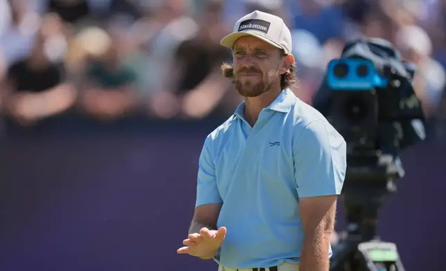 Tommy Fleetwood of England reacts to his tee shot on the 4th hole during the final day of the British Open Golf championships at Royal Birkdale golf club, in Southport, England, Sunday, July 19, 2026. (AP Photo/David Goldman)