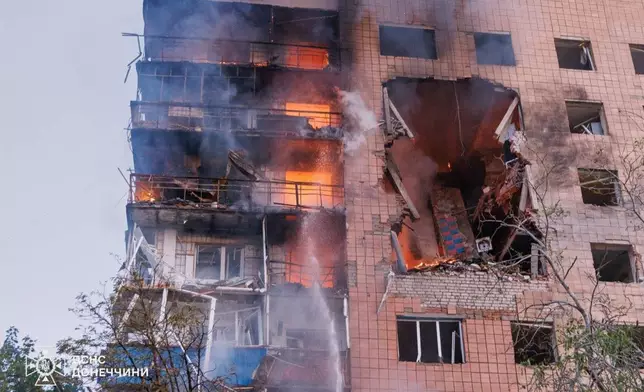 In this photo provided by the Ukrainian Emergency Service, a residential building is seen in fire following a Russian air attack in Kramatorsk, Donetsk region, Ukraine, Monday, July 20, 2026. (Ukrainian Emergency Service via AP)