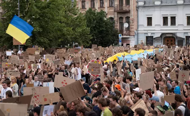 People gather to denounce President Volodymyr Zelenskyy's decision to dismiss Defense Minister Mykhailo Fedorov after six months in the post, Kyiv, Ukraine, Sunday, July 19, 2026. (AP Photo/Dan Bashakov)