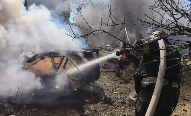 In this photo provided by the Ukrainian Emergency Service, firefighters put out a fire following a Russian air attack in Pavlohrad, Dnipropetrovsk region, Ukraine, Monday, July 20, 2026. (Ukrainian Emergency Service via AP)