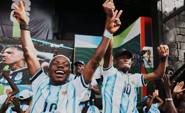 Fans react during the World Cup semifinal soccer match between England and Argentina in Port-au-Prince, Haiti, Wednesday, July 15, 2026. (AP Photo/Odelyn Joseph)
