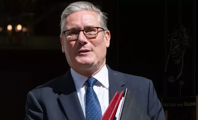 Britain's Prime Minister Keir Starmer leaves 10 Downing Street to attend Prime Minister's Questions at the House of Commons in London, Wednesday, July 15, 2026. (AP Photo/Thomas Krych)