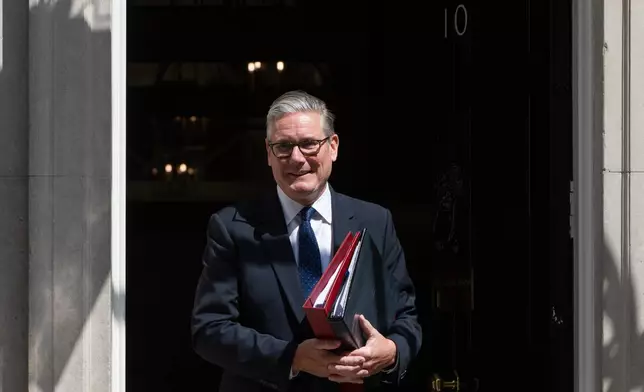 Britain's Prime Minister Keir Starmer leaves 10 Downing Street to attend Prime Minister's Questions at the House of Commons in London, Wednesday, July 15, 2026. (AP Photo/Thomas Krych)