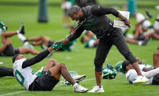 New York Jets head coach Aaron Glenn greets players during an NFL football training camp in Florham Park, N.J., Wednesday, July 29, 2026. (AP Photo/Seth Wenig)