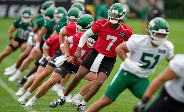 New York Jets quarterback Geno Smith (7) warms-up during an NFL football training camp in Florham Park, N.J., Wednesday, July 29, 2026. (AP Photo/Seth Wenig)