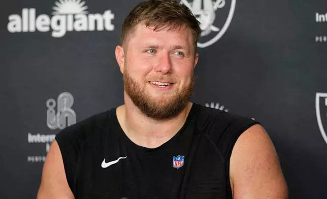 Las Vegas Raiders offensive tackle Kolton Miller (74) speaks during a news conference at the team's NFL football training camp, Wednesday, July 29, 2026, in Henderson, Nev. (AP Photo/Lucas Peltier)
