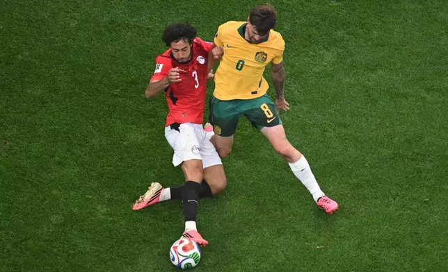 Egypt's Mohamed Hany (3) and Australia's Connor Metcalfe (8) fight for the ball during the World Cup round of 32 soccer match between Australia and Egypt in Arlington, Texas, near Dallas, Friday, July 3, 2026. (AP Photo/Jessica Tobias)