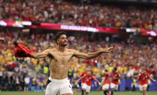 Egypt's Hossam Abdelmaguid (4) celebrates after scoring the winning penalty during World Cup round of 32 soccer match between Australia and Egypt in Arlington, Texas, near Dallas, Tuesday, Friday, July 3, 2026. (AP Photo/Sam Hodde)