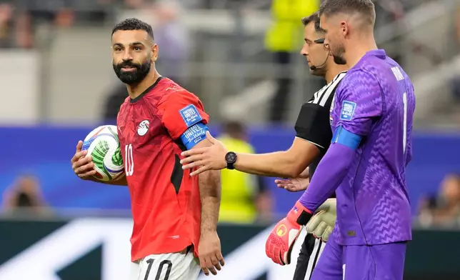 Egypt's Mohamed Salah reacts after scoring during a penalty shootout against Australia for the World Cup round of 32 soccer match in Arlington, Texas, near Dallas, Friday, July 3, 2026. (AP Photo/Tony Gutierrez)