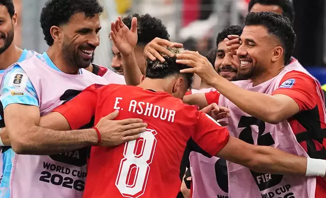 Egypt's Emam Ashour (8) celebrates with teammates after scoring the opening goal during a World Cup round of 32 soccer match between Australia and Egypt in Arlington, Texas, near Dallas, Friday, July 3, 2026 (AP Photo/Julio Cortez)