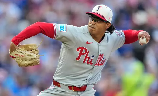 Philadelphia Phillies starting pitcher Jesus Luzardo throws during the first inning of a baseball game against the Kansas City Royals, Saturday, July 4, 2026, in Kansas City, Mo. (AP Photo/Charlie Riedel)