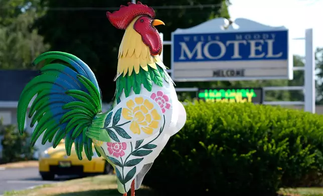 A tin rooster stands outside the Wells Moody Motel in Wells, Maine, Wednesday, July 22, 2026. (AP Photo/Robert F. Bukaty)