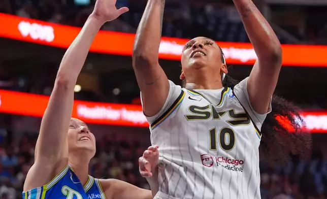 Chicago Sky center Kamilla Cardoso (10) shoots against Dallas Wings guard Paige Bueckers (5) during the first half of a WNBA basketball game in Dallas, Sunday, July 12, 2026. (AP Photo/LM Otero)