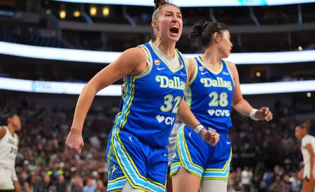 Dallas Wings forward Jessica Shepard (32) reacts after scoring during the second half of a WNBA basketball game against the Chicago Sky in Dallas, Sunday, July 12, 2026. (AP Photo/LM Otero)
