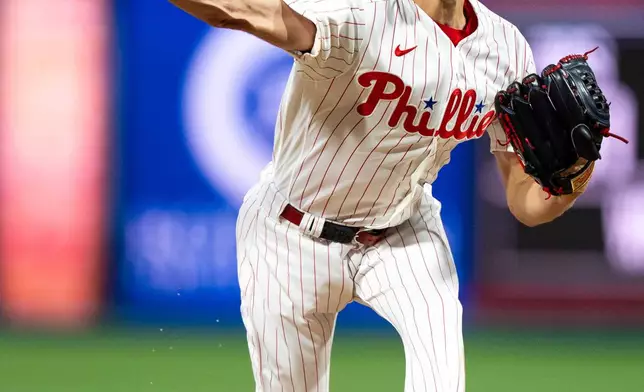 Philadelphia Phillies starting pitcher Zack Wheeler delivers during the first inning of a baseball game against the Los Angeles Dodgers, Tuesday, July 21, 2026, in Philadelphia. (AP Photo/Chris Szagola)