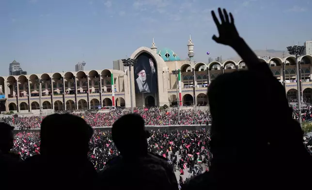 Mourners attend the start of the dayslong funeral ceremonies for slain Iranian Supreme Leader Ayatollah Ali Khamenei and members of his family at the Imam Khomeini Mosalla Grand Mosque in Tehran, Iran, Saturday, July 4, 2026. (AP Photo/Altaf Qadri)