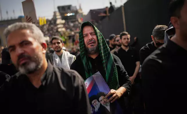 Mourners attend the start of the dayslong funeral ceremonies for slain Iranian Supreme Leader Ayatollah Ali Khamenei and members of his family at the Imam Khomeini Mosalla Grand Mosque in Tehran, Iran, Saturday, July 4, 2026. (AP Photo/Altaf Qadri)