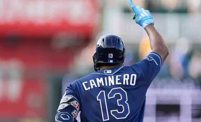 Tampa Bay Rays' Junior Caminero runs the bases after hitting a three-run home run during the third inning of a baseball game against the Kansas City Royals, Tuesday, June 30, 2026, in Kansas City, Mo. (AP Photo/Charlie Riedel)