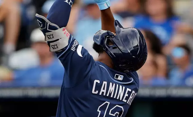 Tampa Bay Rays' Junior Caminero celebrates at home plate after hitting a two-run home run during the first inning of a baseball game against the Kansas City Royals in Kansas City, Mo., Wednesday, July 1, 2026. (AP Photo/Colin E. Braley)