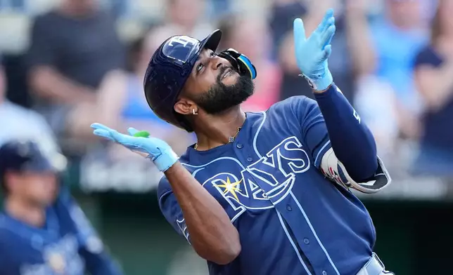 Tampa Bay Rays' Junior Caminero celebrates after hitting a three-run home run during the third inning of a baseball game against the Kansas City Royals, Tuesday, June 30, 2026, in Kansas City, Mo. (AP Photo/Charlie Riedel)
