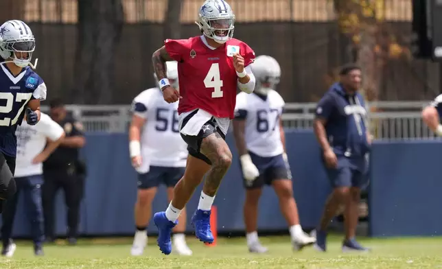 Dallas Cowboys quarterback Dak Prescott runs during the NFL football team's training camp, Wednesday, July 29, 2026, in Oxnard, Calif. (AP Photo/Mark J. Terrill)