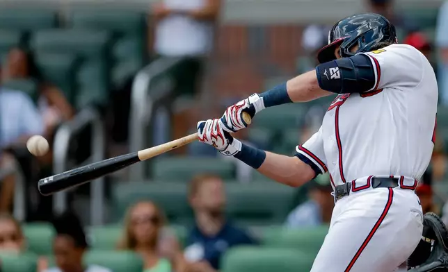 Atlanta Braves' Austin Riley hits a solo home run against the Texas Rangers during the second inning of a baseball game, Sunday, July 19, 2026, in Atlanta. (AP Photo/Erik S. Lesser)