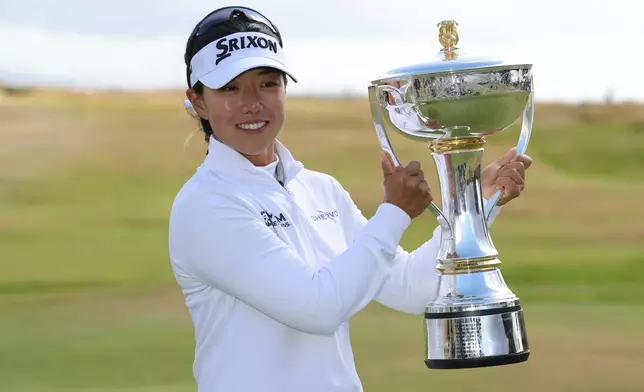 Jenny Shin of South Korea celebrates winning the 2026 ISPS HANDA Women's Scottish Open at Dundonald Links, Ayrshire, Sunday July 26, 2026. (Steve Welsh/PA via AP)