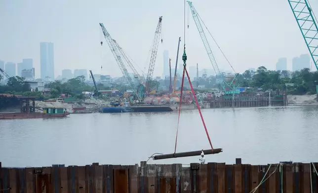 The construction site of a new bridge crossing the Red river is seen in Hanoi, Vietnam, Thursday, June 11, 2026. (AP Photo/Hau Dinh)