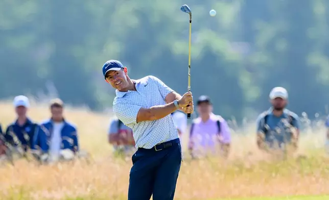 Rory McIlroy, of Northern Ireland, plays on the 14th fairway during day one of the Genesis Scottish Open 2026 at The Renaissance Club in North Berwick, Scotland, Thursday, July 9, 2026. (Malcolm Mackenzie/PA via AP)